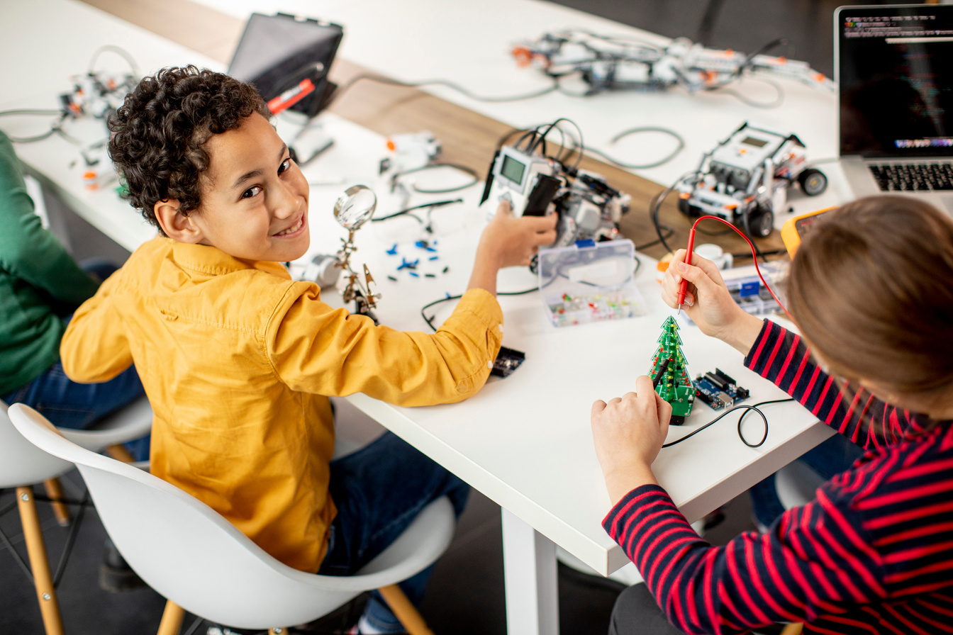 Happy Kids Programming Electric Toys and Robots at Robotics Clas